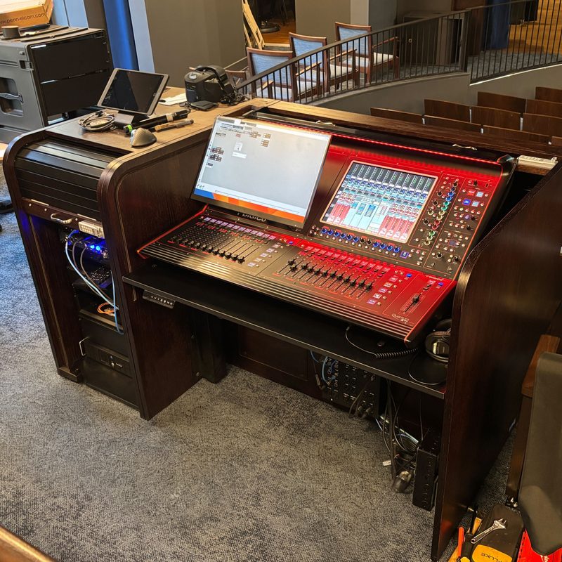 Ascension 1860-D lift desk installed in a control room with the rolltop closed