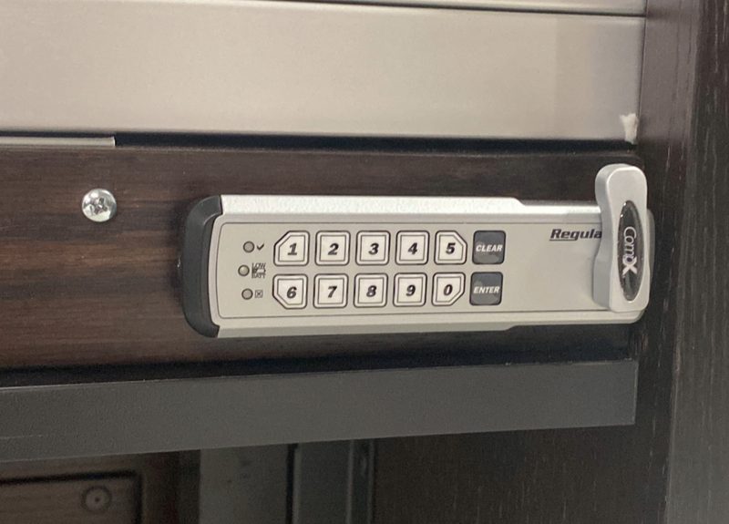 Digital programmable e-lock keypad mounted on an aluminum rolltop desk