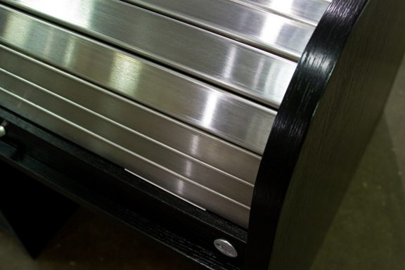 Close view of the one inch thick sidewall and lock body on a desk