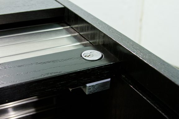 ILS lock body close up mounted in a one inch thick desk sidewall