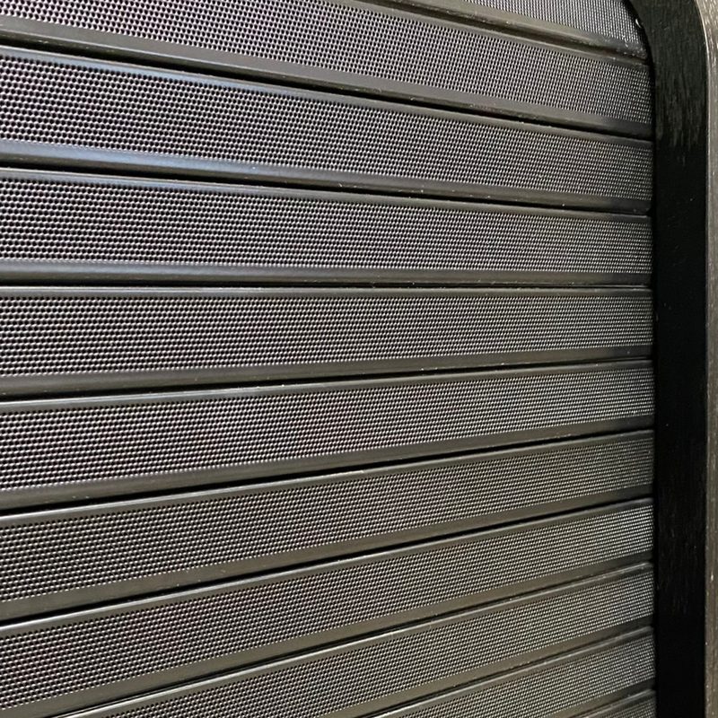Perforated powder coated tambour panel shown closed on an HSA rack